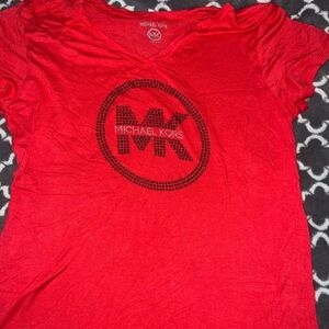 I’m selling this Michael Kors women shirt in a size large it’s new without tags
